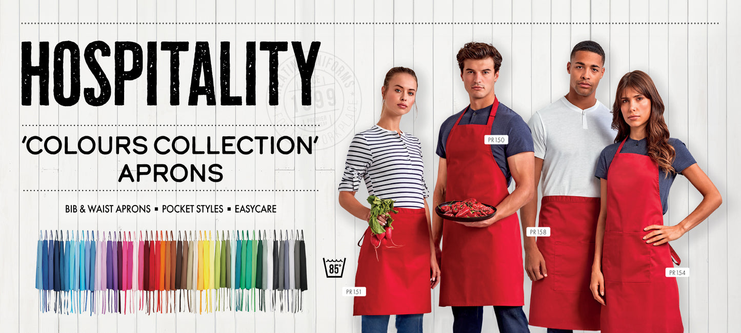 Four hospitality staff members posing in a variety of colorful Premier aprons and uniforms from the print lab collection, showcasing professional clothing finished with high-quality embroidery by Print Press.