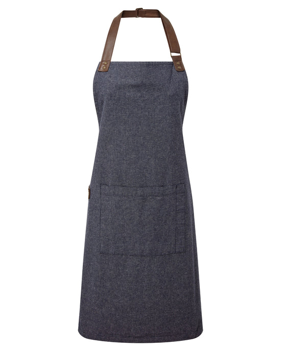Blue apron with brown leather straps on a white background